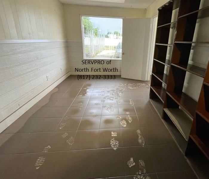 image containing indoor room walls and muddy tile floor