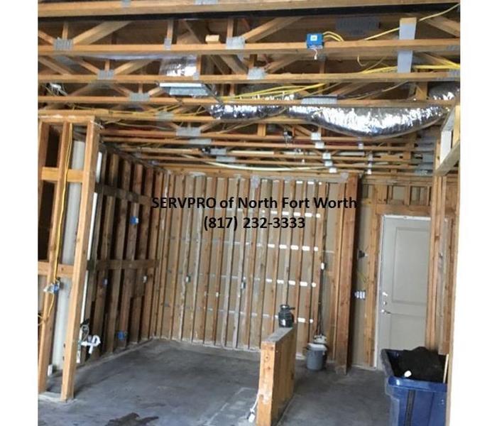 image containing indoor wood stud walls concrete floor