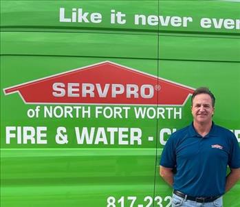 Picture of Scott Blind next to Servpro truck